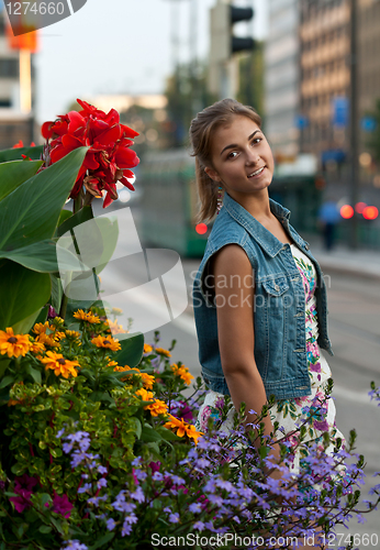 Image of portrait of a girl in a denim vest