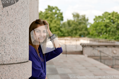 Image of beautiful girl in the column