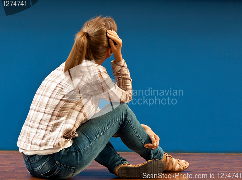 Image of Offended by a girl sitting on the floor