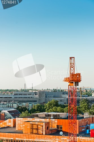 Image of Construction sight with crane and buildings