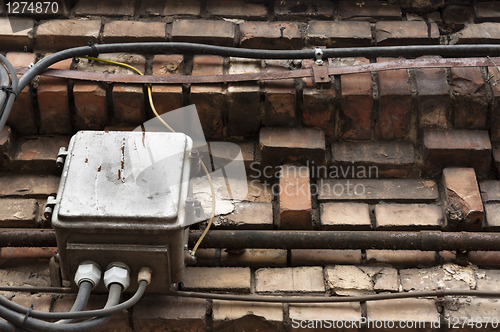 Image of old brick wall with electrical boxes