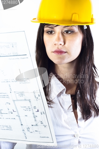 Image of Engineer woman in yellow helmet with plans