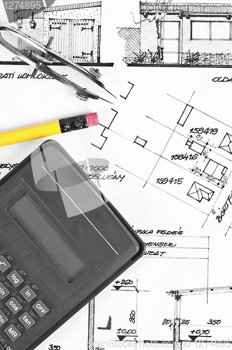 Image of Calculator and pencil on construction plans