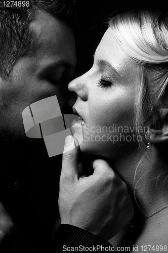 Image of young couple kissing