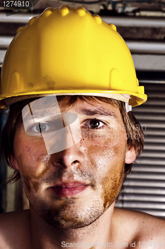 Image of Worker in yellow helmet