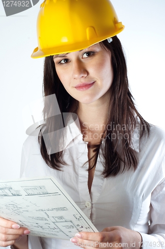 Image of Beautiful business woman with construction plans