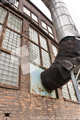 Image of Fragment of old industrial building with heat pipe