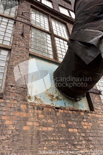 Image of Fragment of old industrial building with heat pipe