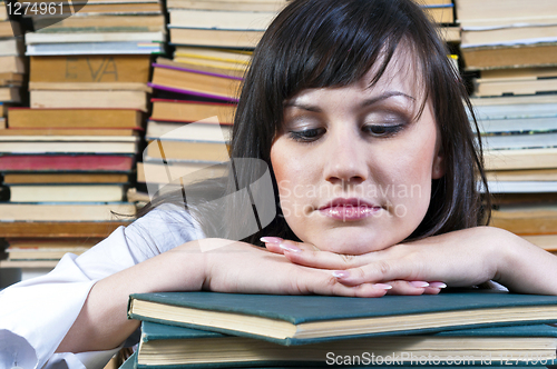 Image of A beautiful young student girl with her books