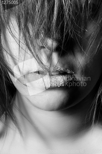 Image of Closeup of a girl with sugar on her lips