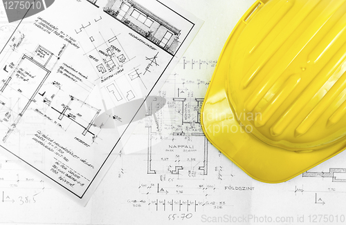 Image of Construction plans with tools of a worker