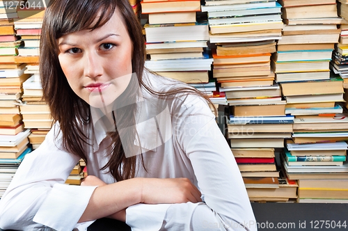 Image of Beautiful young student girl in library