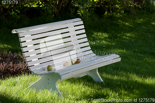 Image of White old bench with apples