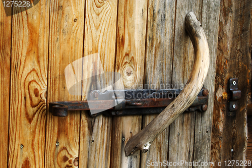 Image of Foto of doorknob on old wood door
