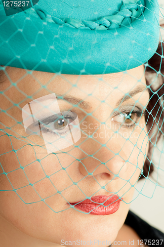 Image of woman in green hat