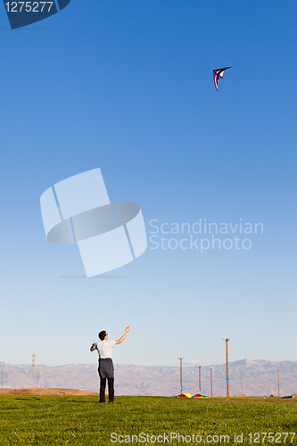 Image of man flying a kite