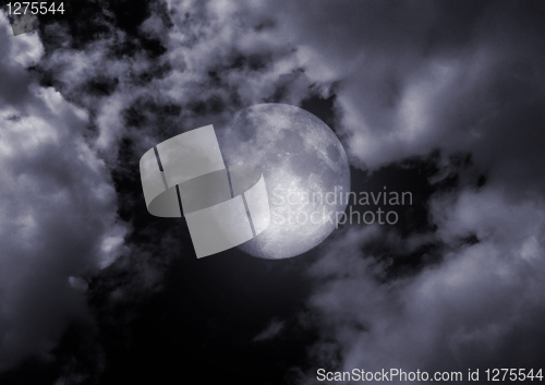 Image of full moon in clouds