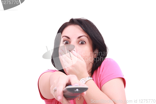 Image of Scared young woman while watching TV in a white background