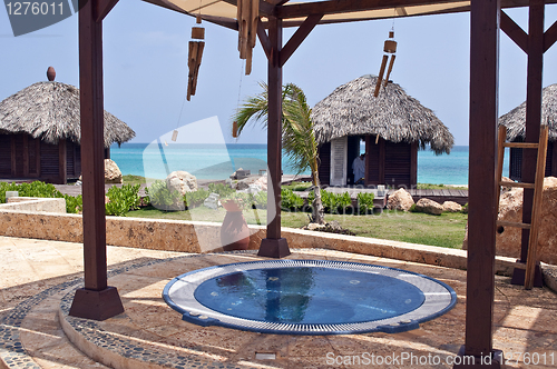 Image of Jacuzzi and massage huts in the Caribbean.