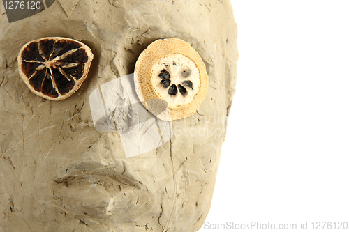 Image of handmade statue with lemon eyes 