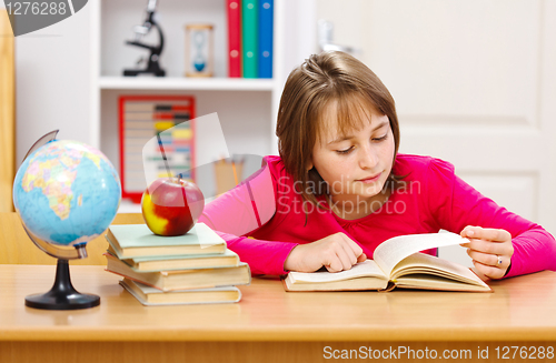 Image of Teen girl reading book