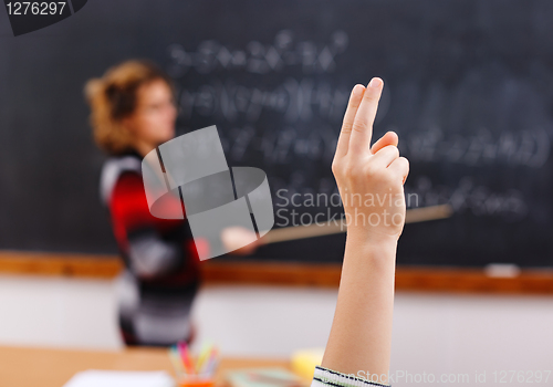 Image of Raised arm in math class