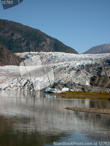 Image of Glacier touching meltwater lake in Alaska.