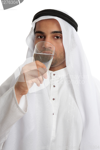 Image of Arab man drinking pure fresh water