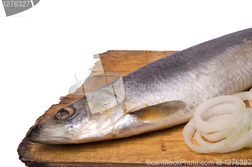 Image of Herring with onion rings on old wooden board