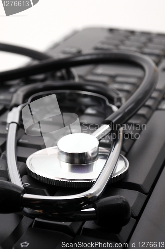 Image of stethoscope on computer keyboard