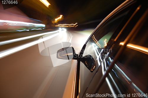 Image of night drive with car in motion 