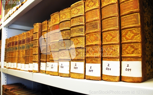 Image of old books in a library