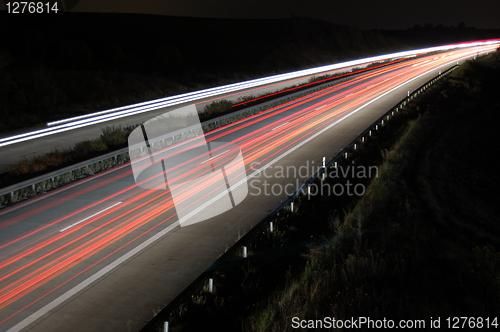 Image of highway at night with traffic