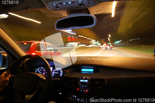 Image of night drive with car in motion 