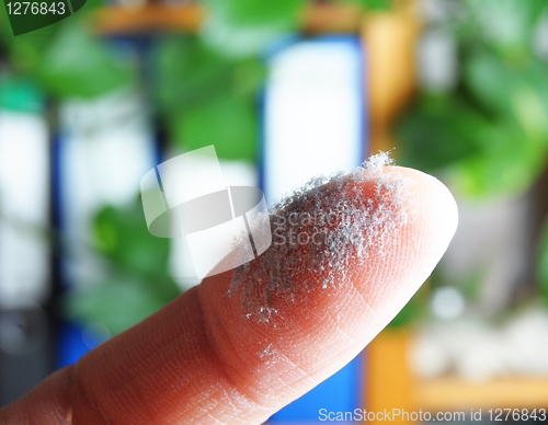 Image of dust and finger