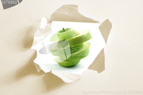 Image of sliced apple and hole in paper