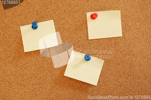 Image of blank sheet of paper on bulletin board