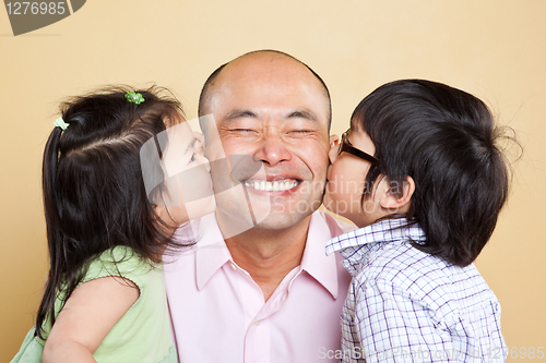 Image of Asian father and kids