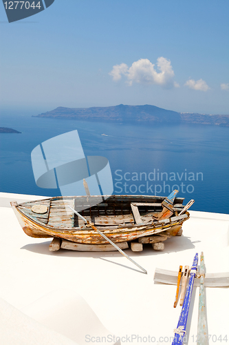 Image of Old rowing boat in Santorini, Greece