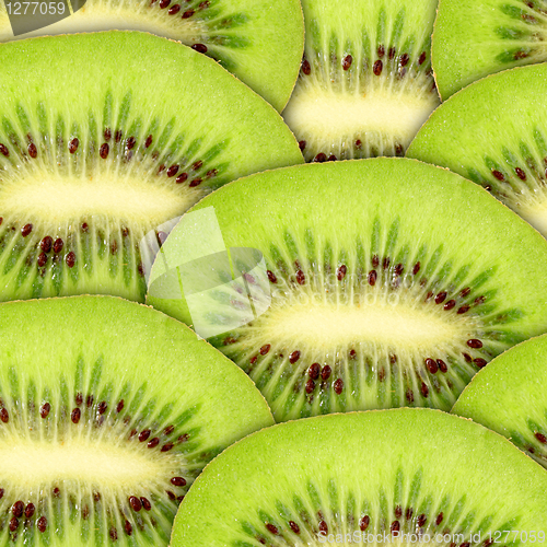 Image of Abstract green background with raw kiwi slices