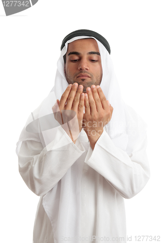 Image of Arab man with open palms praying