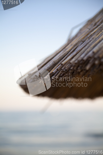 Image of umbrella on sea background