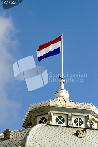 Image of Dutch flag waving on the roof of Kurhaus hotel