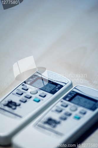 Image of Two remote controllers of Air conditioners