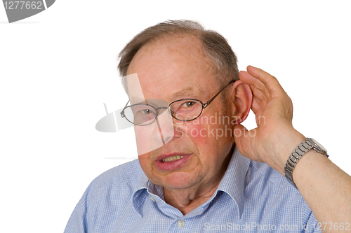 Image of Male senior with hand on ear