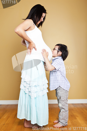 Image of Pregnant Asian mother and her son