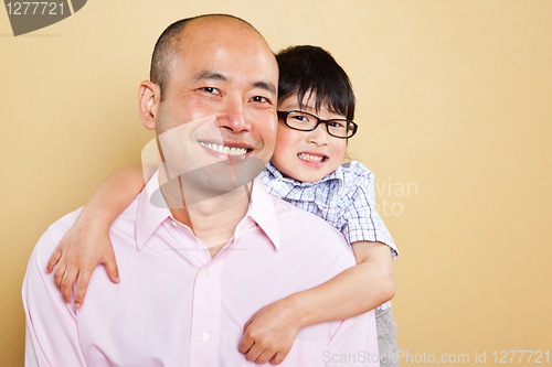 Image of Asian father and son