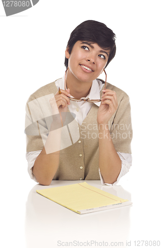 Image of Daydreaming Hispanic Young Adult Female Student at Table