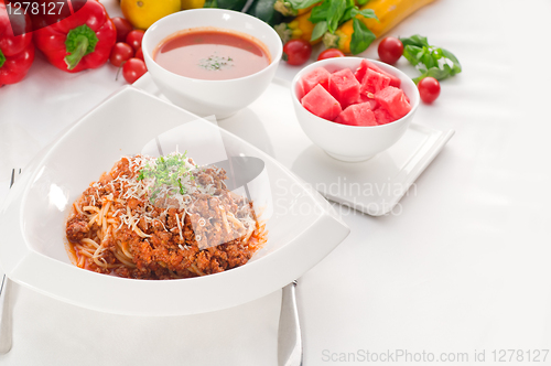 Image of spaghetti with bolognese sauce with gazpacho soup and fresh vege