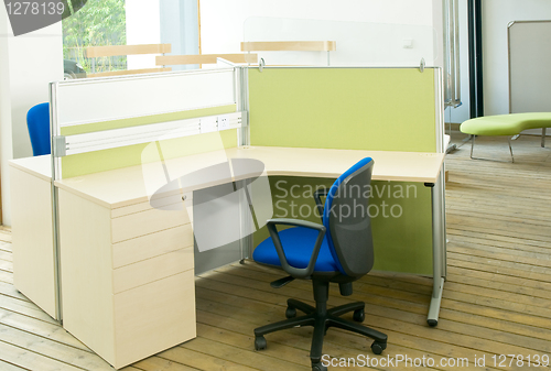 Image of office desks and blue chairs cubicle set 